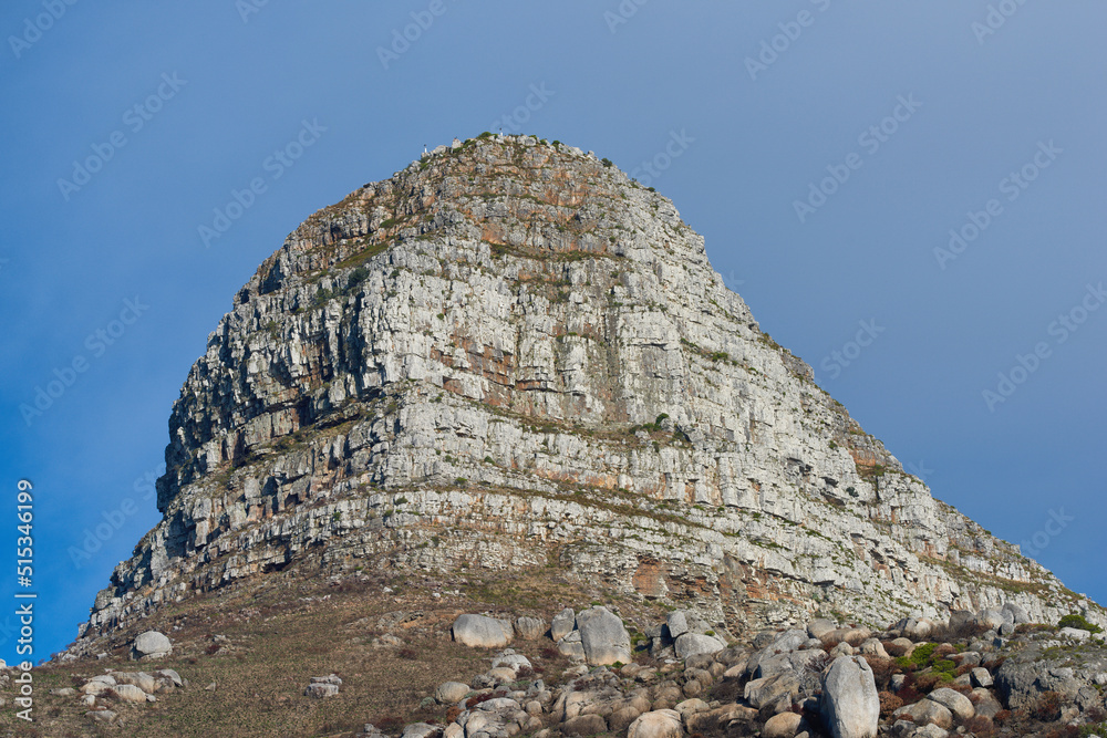 Fototapeta premium Copy space with scenic view of Lions Head mountain in Cape Town South Africa against a clear blue sky background from below. Beautiful panoramic of an iconic landmark and famous travel destination