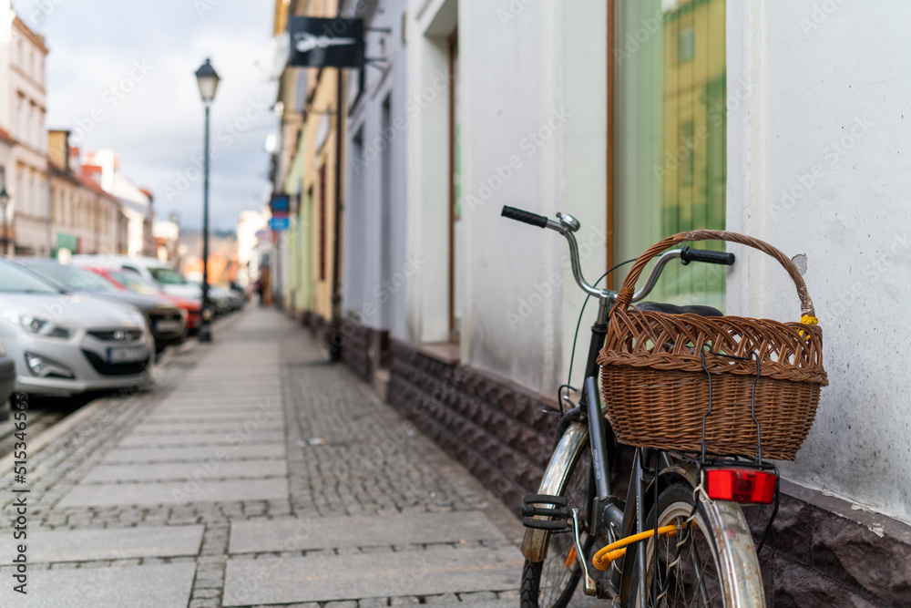 Newspaper in a bicycle with basket Newspaper in a bicycle with basket