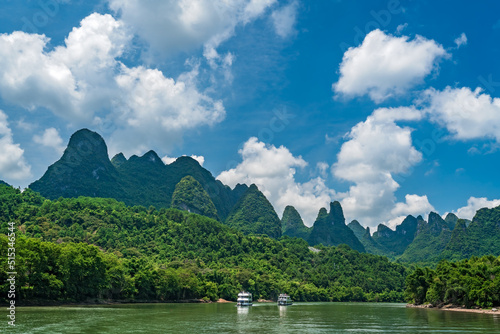 Tourist boats sailing on a Li River in China photo