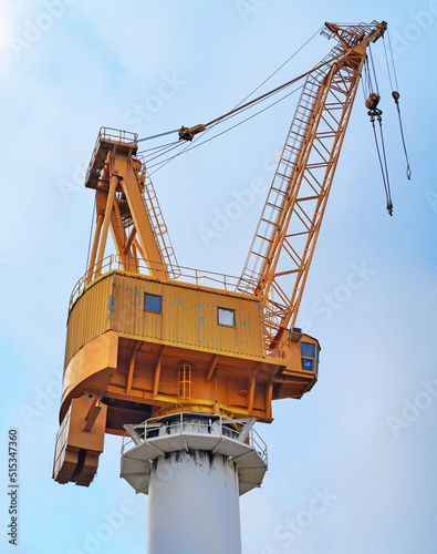Big crane in sea port with sky background 