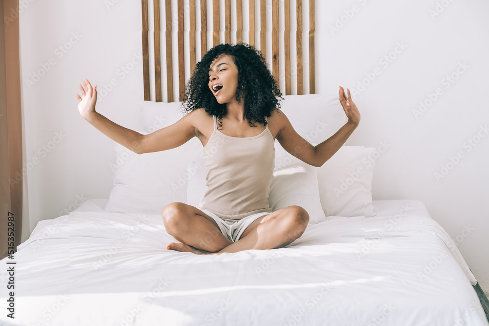 Morning positive mood concept. Young african woman had a good sleep wake up and have fun at home or hotel Morning positive mood concept. Young african woman had a good sleep wake up and have fun at home or hotel