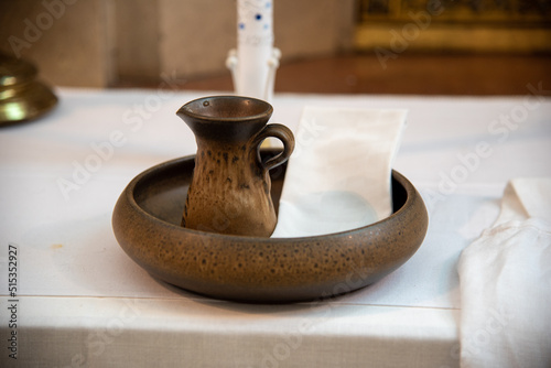 Billede på lærred pot with sacred holy water and napkin for baptism