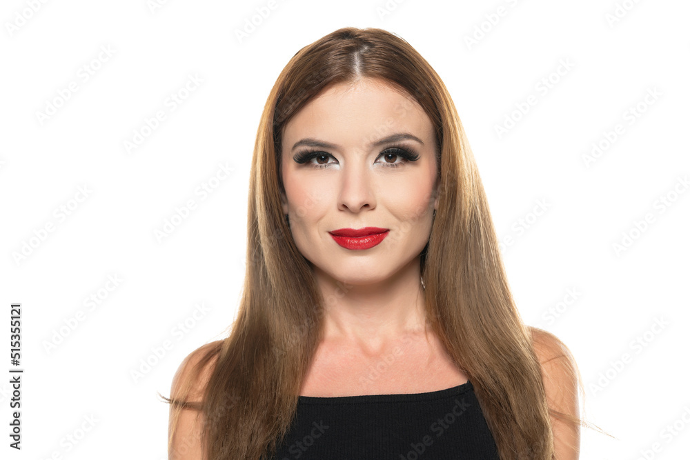 portrait of a young woman with make up and with long hair on a white background
