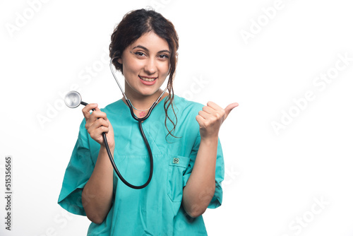 Female doctor showing thumbs up with stethoscope on white background