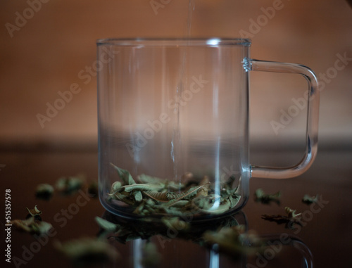 Glass mug with vervain tea