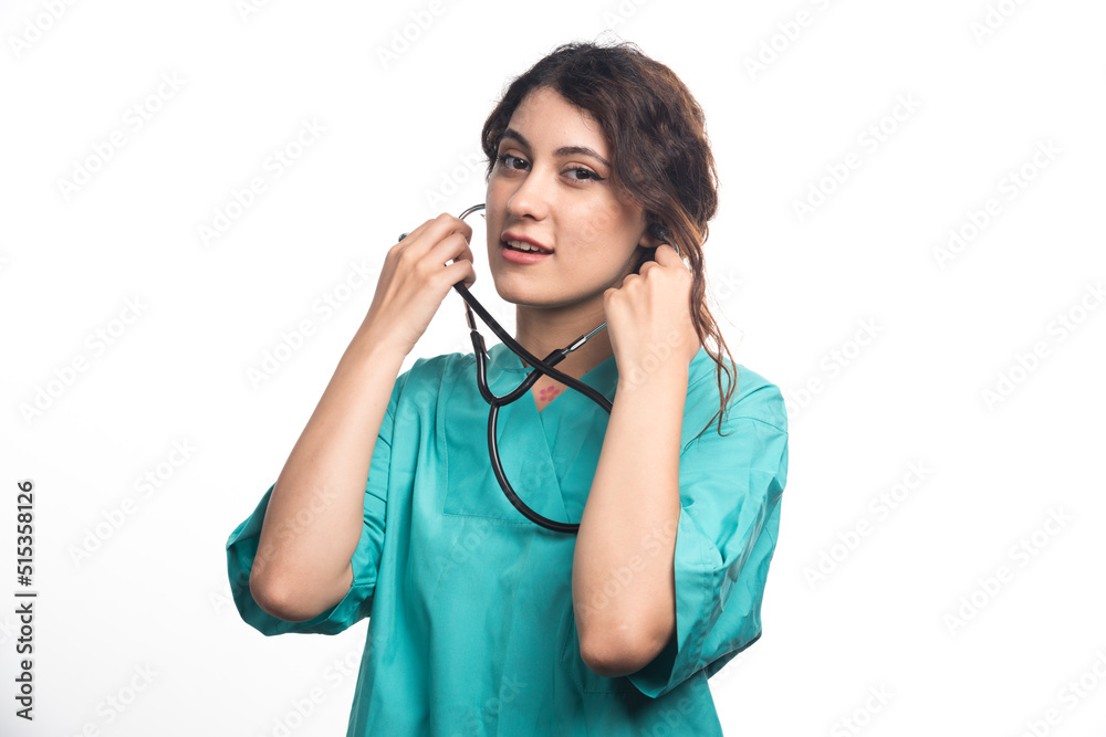 Female doctor with stethoscope on white background Female doctor with stethoscope on white background