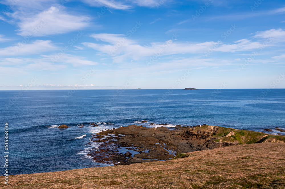 Blue sky view from a landscape coastal headland lookout at Woolgoolga, a Northern New South Wales town, famous for its scenery, farming and tourism. Blue sky view from a landscape coastal headland lookout at Woolgoolga, a Northern New South Wales town, famous for its scenery, farming and tourism.