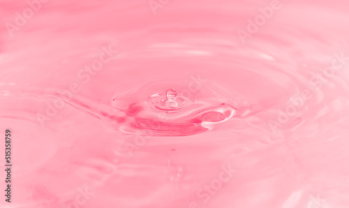 water drop, bubbles and water ripples on pale pink light effects background. 