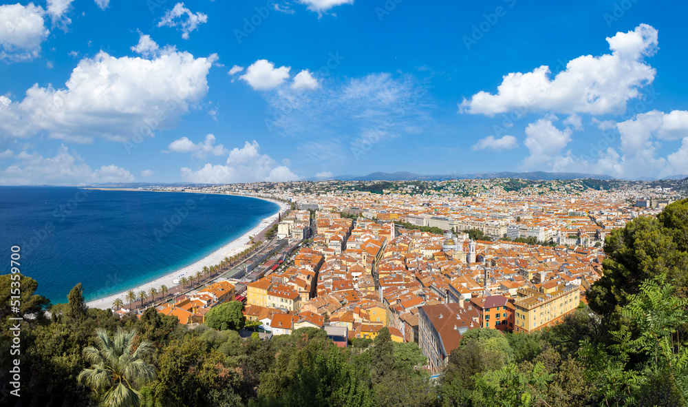 France, panoramic skyline of old historic Nice center and azure beaches along Promenade des Anglais.