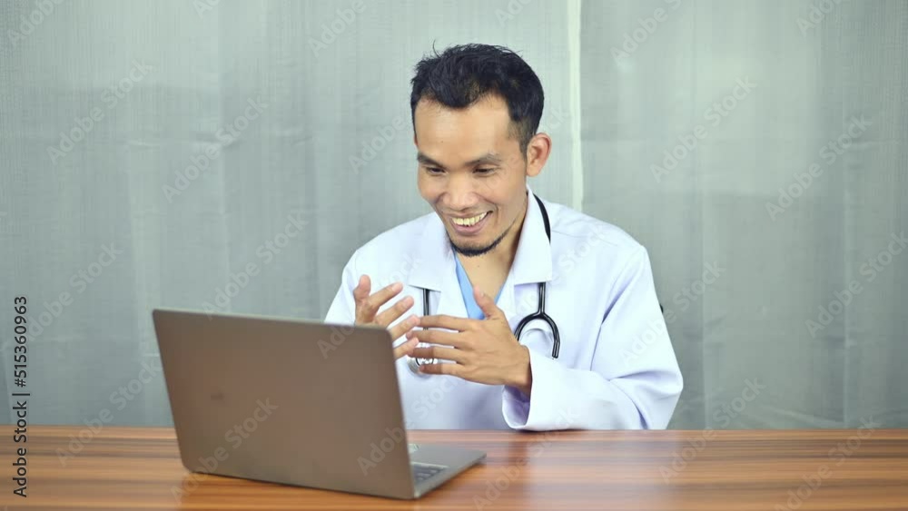 Asian doctor working laptop computer in office at hospital, Consulting and therapy concept. Asian doctor working laptop computer in office at hospital, Consulting and therapy concept.