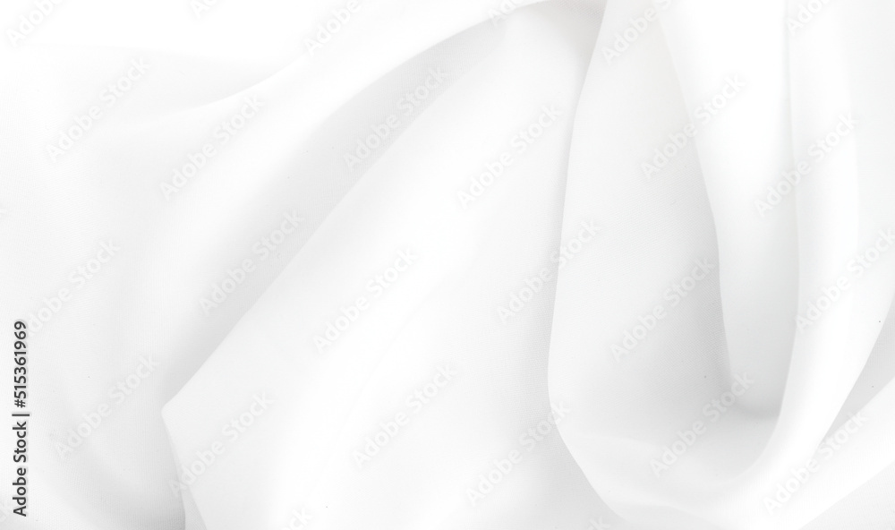 Smooth elegant white silk or elegant satin texture can be used as background. Smooth elegant white silk or elegant satin texture can be used as background.