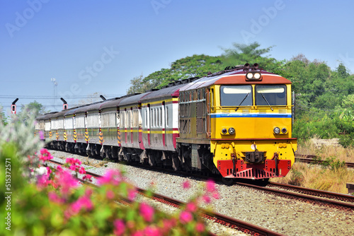 Thai passenger train by diesel locomotive on the railway
