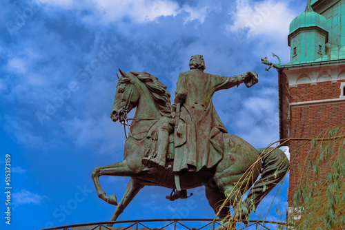Close-up of an equestrian statue with a rider against a blue sky on a sunny day at the western entrance to the Wawel Royal Castle in Krakow, a gift to Poland on behalf of the people of Dresden