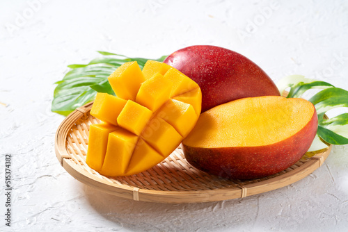Mango background design concept. Top view Diced fresh mango fruit on white table.