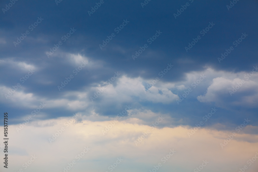 Blue and white cumulus clouds , sky background Blue and white cumulus clouds , sky background