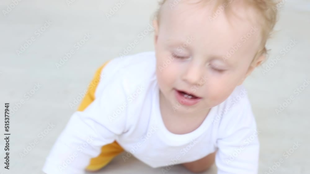 baby boy crawling and smiling in the living room baby boy crawling and smiling in the living room