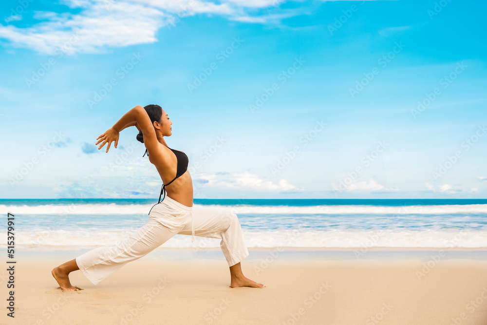 woman practicing yoga at seashore of tropic beach,Sports lady standing at the beach make yoga exercises woman practicing yoga at seashore of tropic beach,Sports lady standing at the beach make yoga exercises