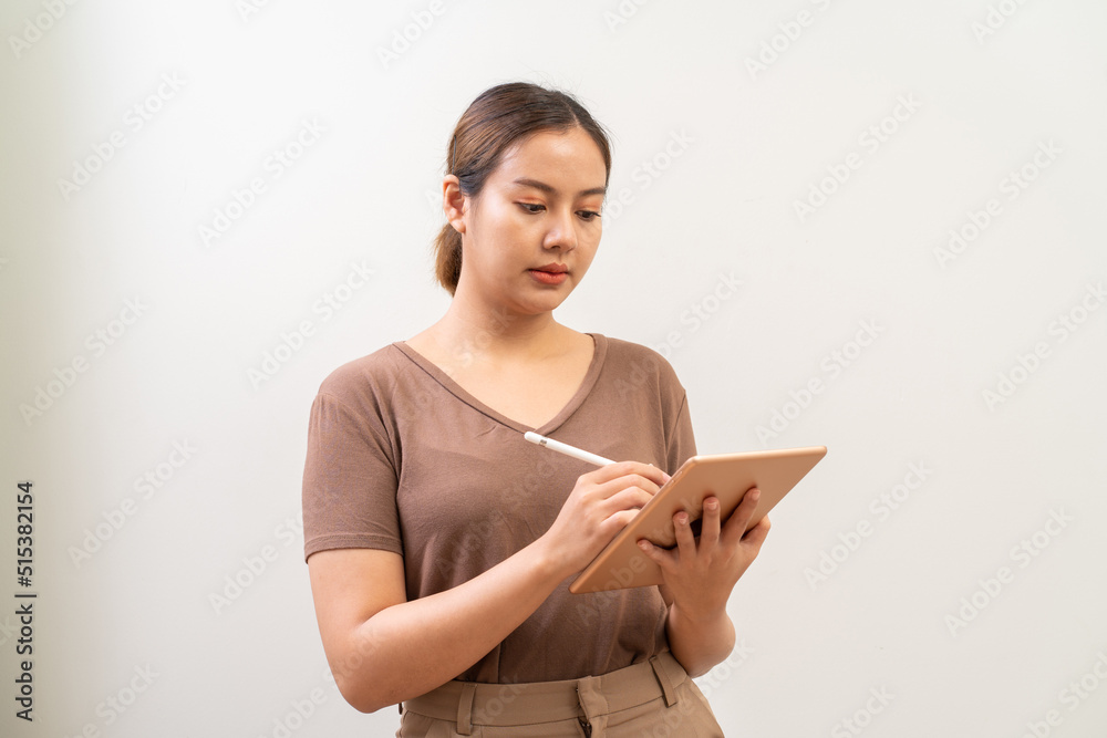 Asian women working on digital tablet computer Asian women working on digital tablet computer