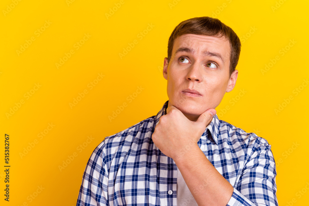Photo of young handsome guy hand touch chin dream think look empty space isolated over bright color background Photo of young handsome guy hand touch chin dream think look empty space isolated over bright color background