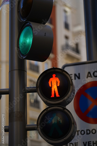 traffic light indicating the red color for pedestrians. Stop.