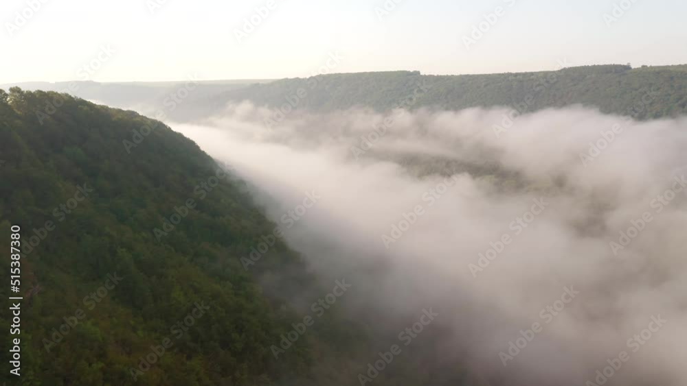 Gorgeous landscape covered with thick morning fog. Filmed in UHD 4k video. Gorgeous landscape covered with thick morning fog. Filmed in UHD 4k video.