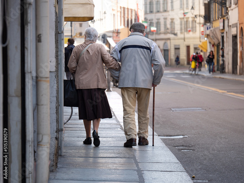 Couple of Elderly Husband and Wife Walking Together in the City Center