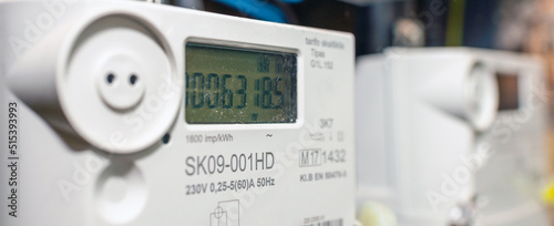 Two smart electric power meter counter measuring power usage.Banner,advertisement.Close-up of modern smart grid residential digital power supply meter.Indoors shot.Selective focus. photo