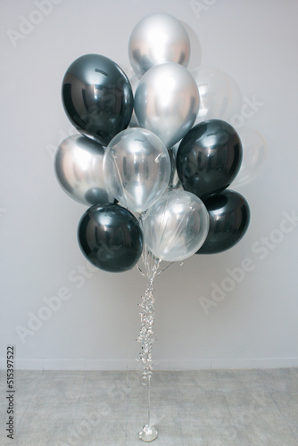 set of black birthday balloons
