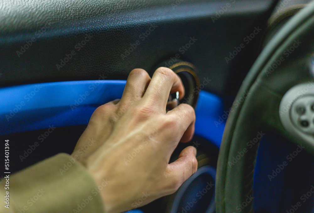 Close-up of a man's hand on the handle of the car door opener. A man opens the doors from inside the interior of a luxury car selective focus.