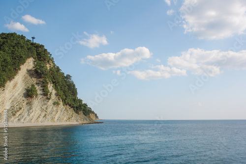 View of the mountain landscape. Blue sky. Blue sea on the background of mountains. Panoramic sea and mountain views. The white mountains are washed by the sea. © Dmitry Presnyakov