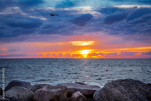 sunset over the Oresund sea, seen from Malmo, Sweden photo