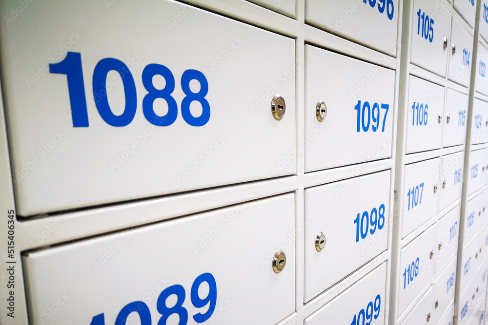 Postal office. Post boxes, storage lockers. The concept of a postman or recipient, delivery or receipt of mail from a metal store by personal number.