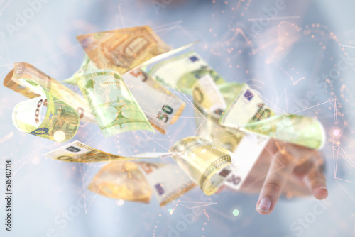 euro bills flying around in hand