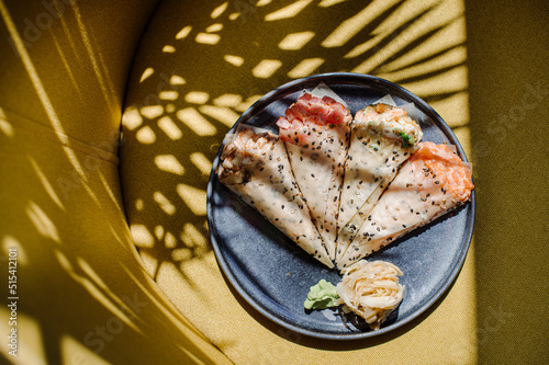 Handroll sushi on the served table in the reastaurant photo