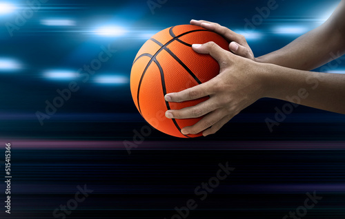 basketball ball in man's hand in competition