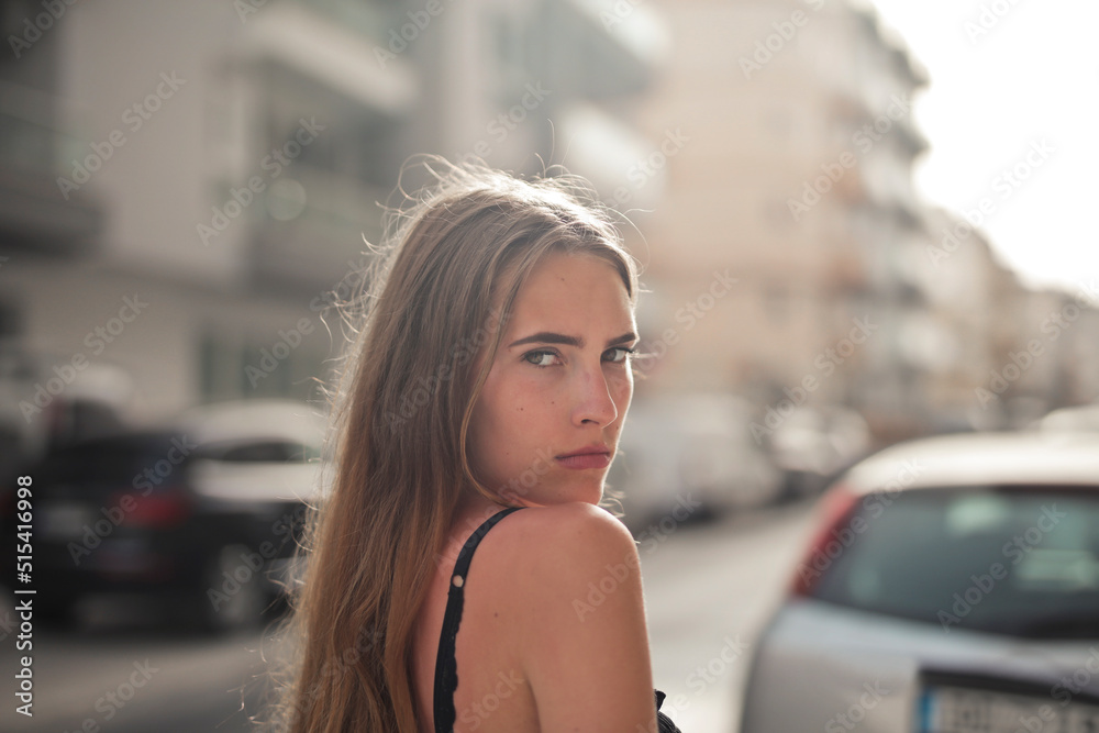 portrait of a young beautiful woman in the street portrait of a young beautiful woman in the street