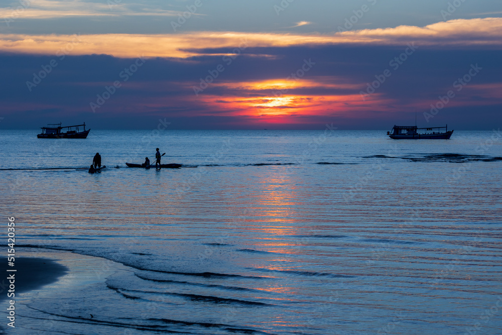 Silhouettes and colorful sunset on the sea Silhouettes and colorful sunset on the sea