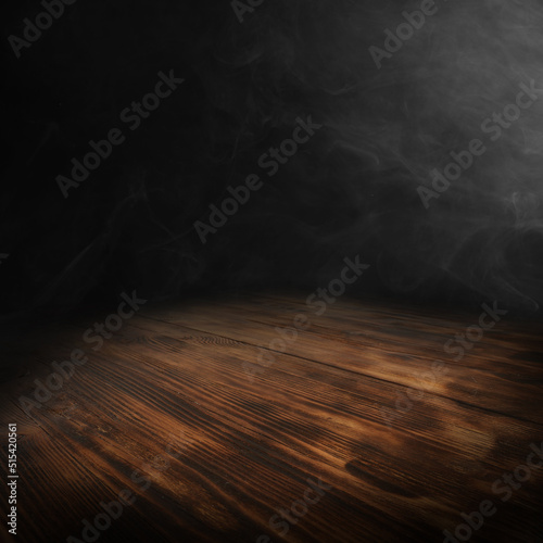Wooden table and black background with smoke. 