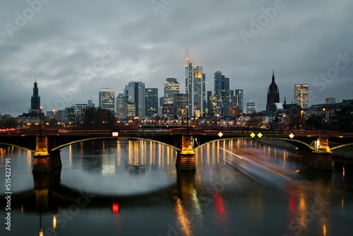 Beautiful view of the Frankfurt skyline behind the Ignatz Bubis bridge on the river Main photo