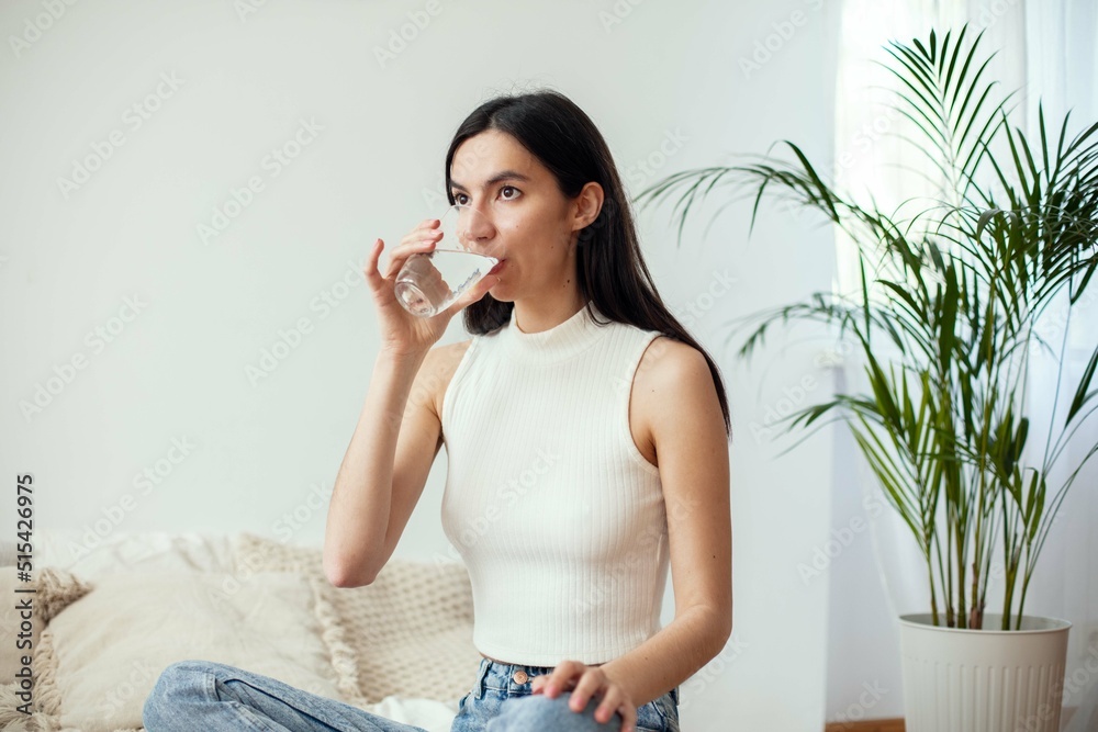 Portrait Of A Young Woman Drinking Water And Smiling. Portrait Of A Young Woman Drinking Water And Smiling.