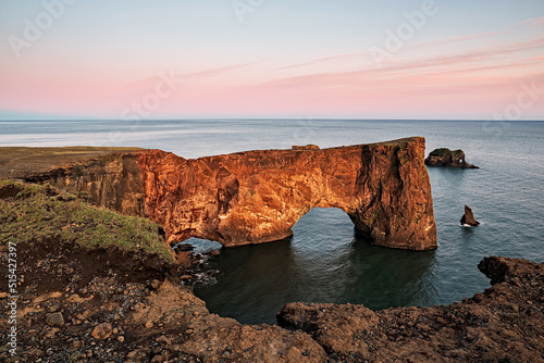 Dyrholaey rock formation at sunset photo