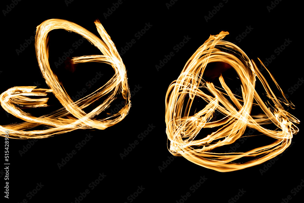 Flames in dark. Fire on black background. Flames in dark. Fire on black background.