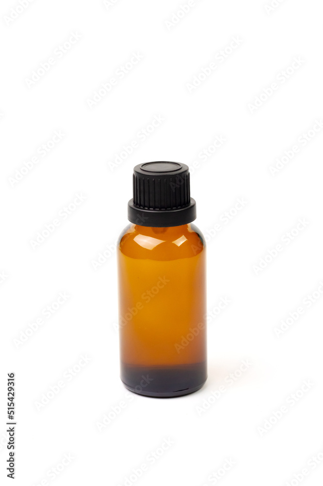 Essential oil in amber bottle isolate on white background. Essential oil in amber bottle isolate on white background.