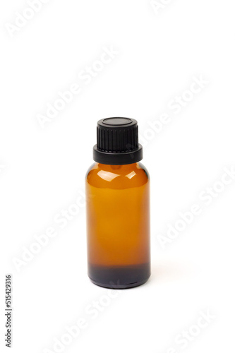 Essential oil in amber bottle isolate on white background.