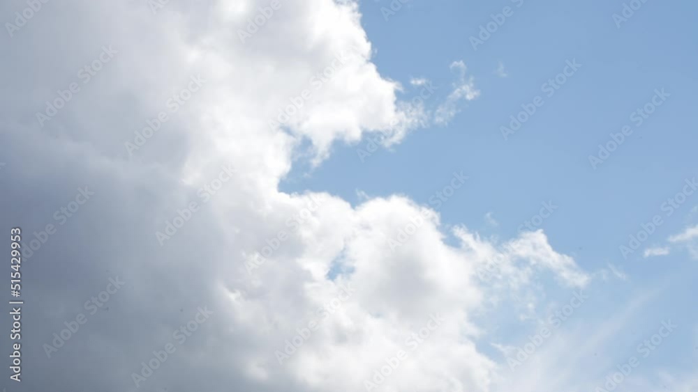 White cloud time lapse revealing blue sky, sunny day with moving clouds White cloud time lapse revealing blue sky, sunny day with moving clouds