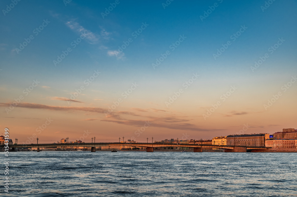 Sunset on the Neva river. View of the Trinity Bridge.