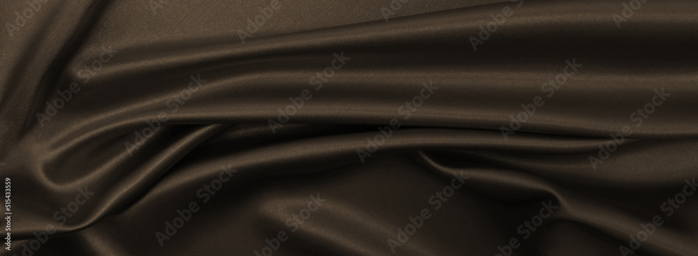 Fototapeta premium Smooth elegant brown silk or satin texture as abstract background. Luxurious background design wallpaper. In Sepia toned. Retro style