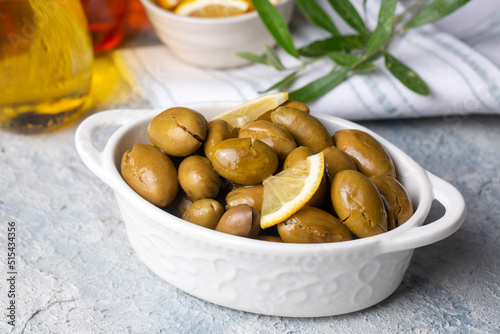 Cracked green olives. Cracked green olives with lemon. Turkish style olive (Turkish name; kirma zeytin)