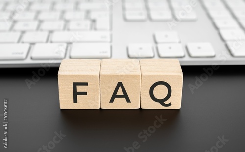 Obraz na plátně FAQ or frequently asked questions on wooden block