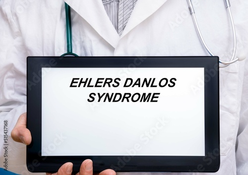Ehlers Danlos Syndrome.  Doctor with rare or orphan disease text on tablet screen Ehlers Danlos Syndrome photo